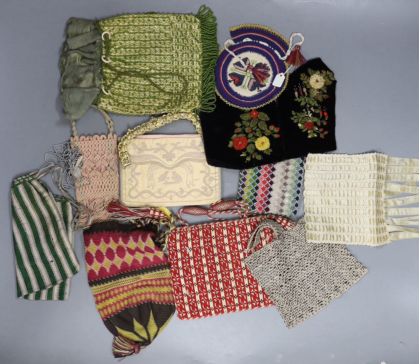 Ten 19th century and later, beaded, ribbon worked, crochet and embroidered, purses, bible bags, sachets and a gilt metal bag frame